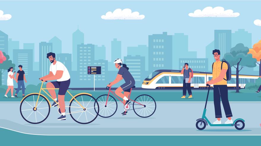 Menschen fahren Fahrrad, ein Zug und eine Stadt im Hintergrund